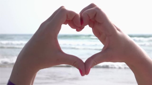 High quality video of heart symbol by the ocean in real 1080p slow motion 250fps