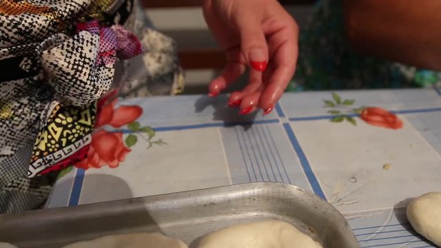 Manual method of preparing dough products. The dough is manually processed into the finished product cooking.