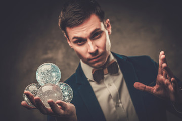 Young illusionist performing tricks on a stage