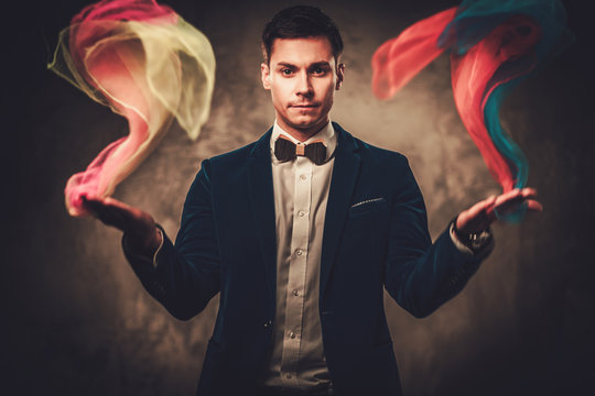 Young Illusionist Performing Tricks On A Stage