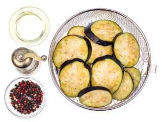 Round slices of eggplant on white background