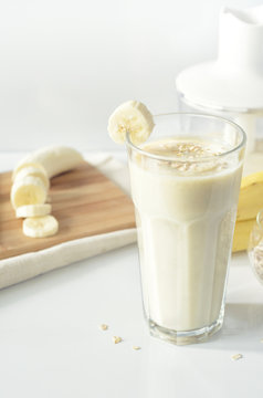 Banana smoothie. Milkshake with banana and oatmeal. Oat smoothies. Healthy breakfast. Picture with space for text or logos