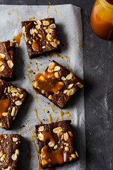 Brownies with caramel and peanuts.