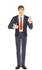 Businessman with mobile phone showing thumb up
