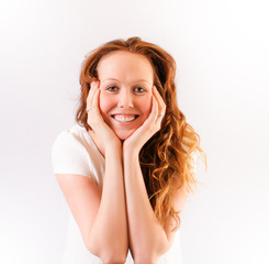 Fototapeta premium Pretty girl with a big smile, chin in her hands