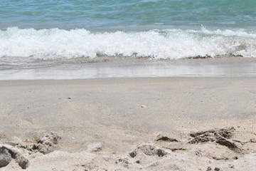 gentle waves crash the sand