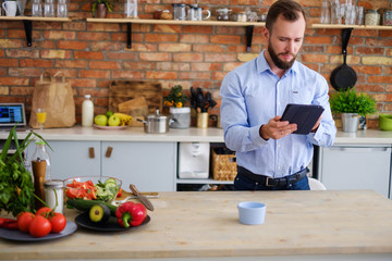 Man man looking for a recipe online