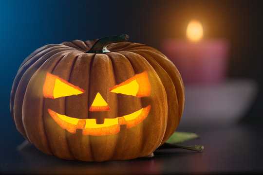 Spooky carved pumpkin indoor as Halloween design