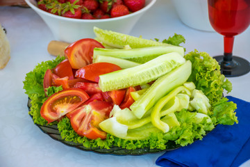 A delicious dish of vegetables - pepper, tomatoes and cucumber.