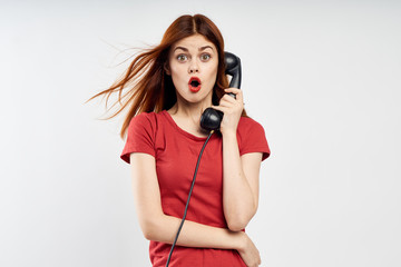 woman calling on a black landline phone, emotions, empty space for copying