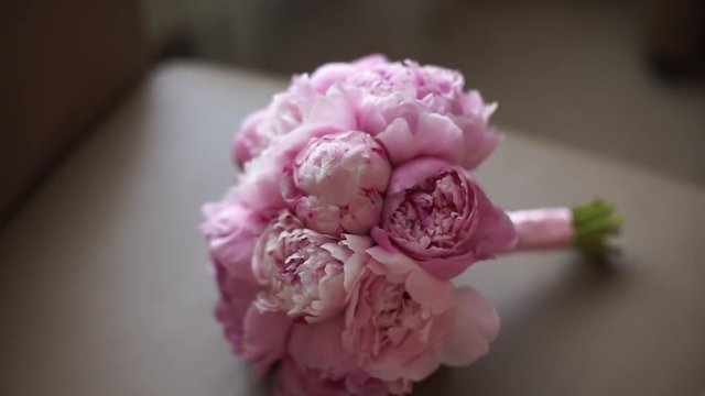 Wedding bouquet of fresh pink peonies