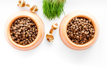 dry pet - dog food in bowl on white background top view