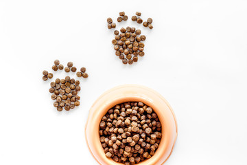 dry pet - dog food in bowl on white background top view mock up