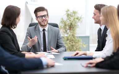 businessman at a meeting with employees