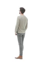 Rear view. Full length. Young man in gray sweater