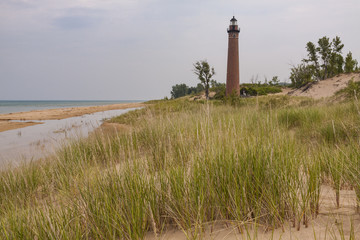 Little Sable Lighthouse / A lighthouse on a beach along Lake Michigan.