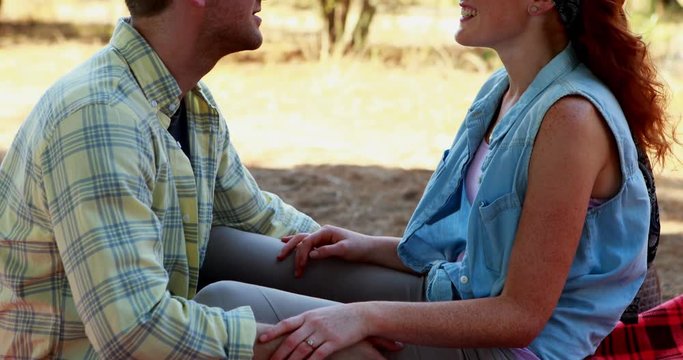 Couple interacting with each other in olive farm 