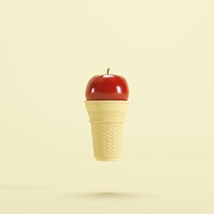 Red apple fruit with Ice cream cone floating on yellow background, minimal fruit concept idea.