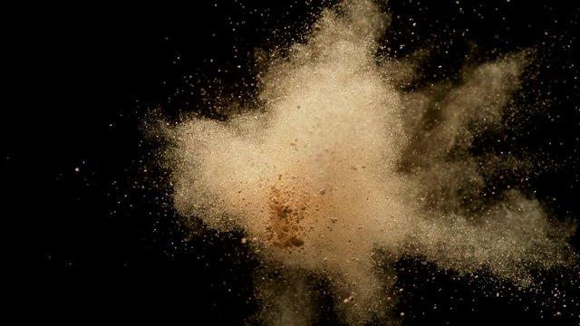 Colorful powder/particles fly after being exploded against black background. Shot with high speed camera, phantom flex 4K. Slow Motion. Unedited version is included at the end of clip.