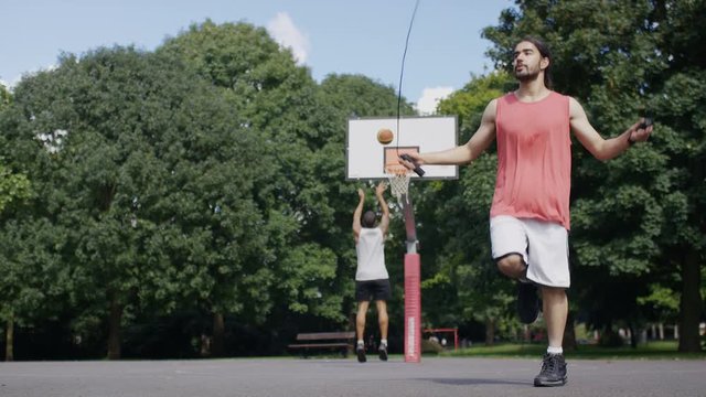 Basketball player skipping with a jump rope, in slow motion