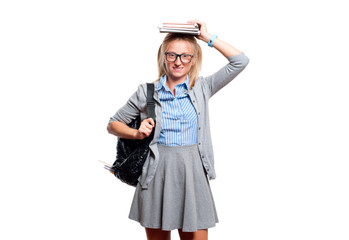 Happy young student girl holding books.  Back to school