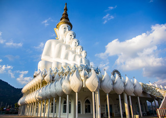 White buddha statue and blue sky