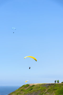tourists paragliding in the sky
