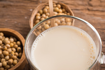 Glass with Soy Milk and Seeds on background