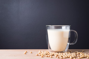 Glass with Soy Milk and Seeds on background