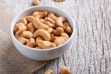Roasted cashew nuts on rustic wood