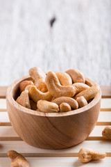 Roasted cashew nuts on rustic wood