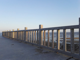 Stone bridge and stone baluster around seaside
