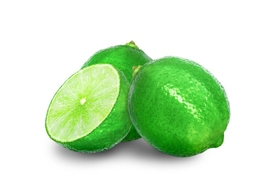 Fresh Green Lime and half isolated on white background