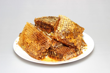 Honey in honeycombs on a plate