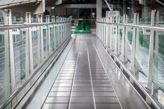 Metal and glass walkway. Hallway in a modern airport.