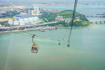 Tourists is traveling by cable car over sea. The transportation between bottom and peak of mount. © joeyphoto