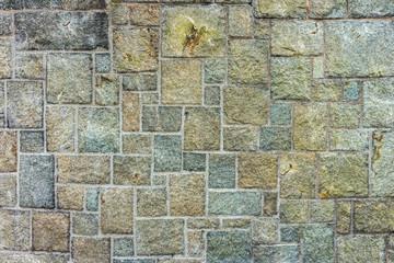 Rectangular pattern on stone wall. For using as background and texture.