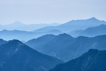 Mountain tops covered in morning haze seen from the top of the Panoramastrasse on Mt. Goldeck