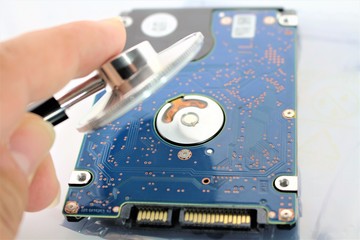 Obraz premium An concept image of a hard drive, disk and a stethoscope