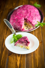 layered pastry salad with herring and beetroot
