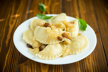 boiled dumplings with potatoes and fried onions