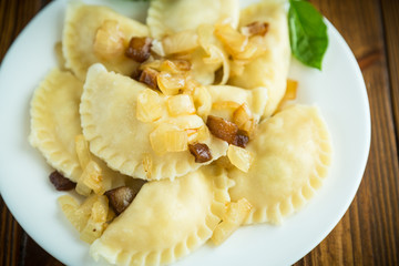 boiled dumplings with potatoes and fried onions
