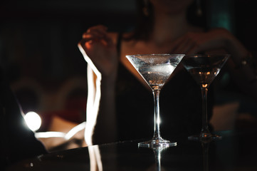 Two glasses of martini coctail in a bar
