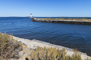 The Les Onglous lighthouse, terminating point of the Canal du Midi where the it enters the Etang de Thau. World Heritage Site. Agde, France