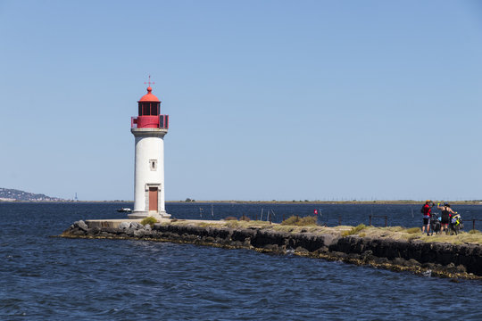 The Les Onglous lighthouse, terminating point of the Canal du Midi where the it enters the Etang de Thau. World Heritage Site. Agde, France
