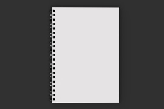 Opend notebook spiral bound on black background