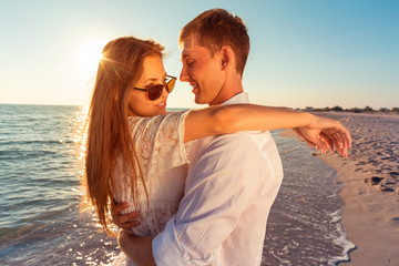 Portrait of a beatiful loving couple having fun at the beach