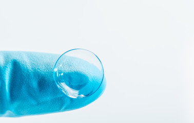 contact lens on finger