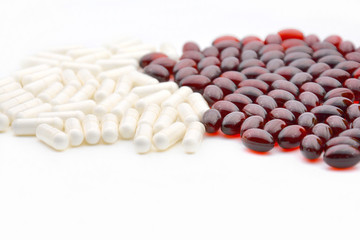 red and white pills on a white background