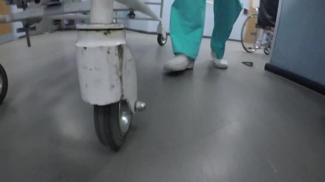 Medics pull the stretchers with sick patient
